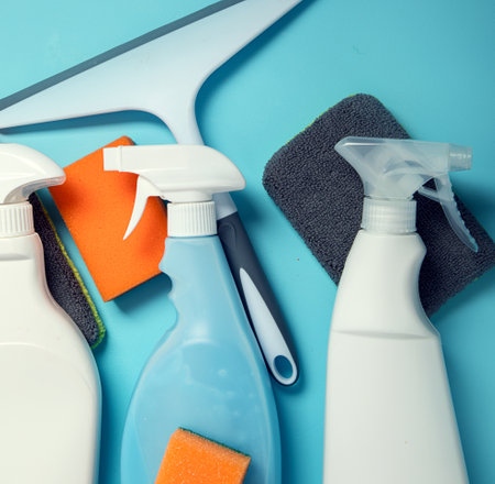cleaning products. Bottles, rubber gloves and sponge. Housework concept, top view.の写真素材
