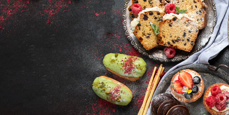 Variety of canapes and appetizers on dark background. top view with copy space