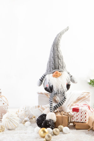 Christmas composition with gnomes and festive decorations on a white background. Christmas or New Year greeting card.の写真素材