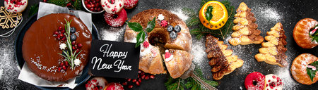 Christmas dessert table with sweets and holiday decorations. Top view, panorama, bannerの写真素材