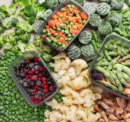 A set of foods for the winter. Various of frozen vegetables and berries. Top view.の写真素材