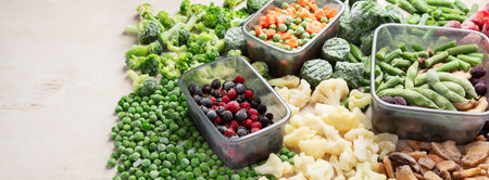 A set of foods for the winter. Various of frozen vegetables and berries. Top view, copy space,...