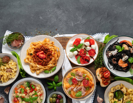 Italian food dishes on dark background. Traditional food concept. Top view, copy space.の写真素材