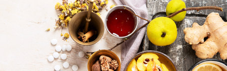 Natural medicinal herbal remedy for cold & flu virus with hot drink with fresh ginger, lemon, honey,...