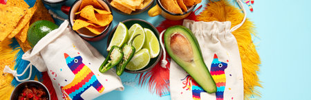 Cinco-de-mayo concept. Traditional food nacho chips salsa sauce chilli tequila with salt lime...