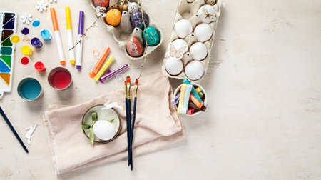DIY Easter egg painting. Holidays and creativity. Tradition concept. Top view, copy spaceの写真素材