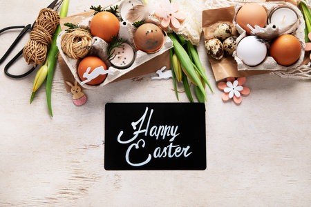 Happy Easter, painting eggs. Paints, pens, decorations for coloring eggs for holiday on a white...