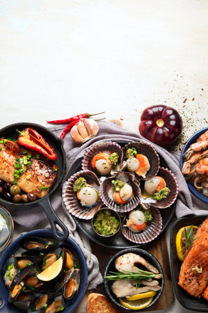 Set of Seafood dishes on light wooden background. Top view, copy spaceの写真素材