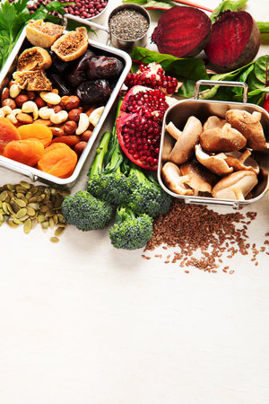 Vegan food rich of iron. Healthy eating. Vegetables, fruits and nuts. Copy spaceの写真素材