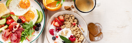 Healthy breakfast with oatmeal, berries, egg, bacon and a cup of coffee. Good morning. Top view, copy spaceの写真素材