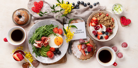 Healthy breakfast with oatmeal, berries, egg, bacon and a cup of coffee. Good morning. Top view, bannerの写真素材