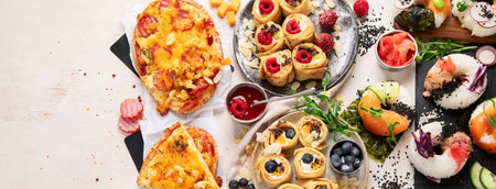 Trend hybrid food. Japanese Asian cuisine. Sushi donuts, sweet sushi pancakes and sauces on a light background. Top view. Panorama with copy space.の写真素材