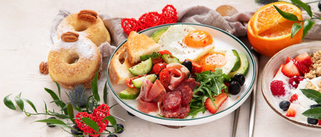 Healthy breakfast with oatmeal, berries, egg, bacon and a cup of coffee. Good morning. Bannerの写真素材