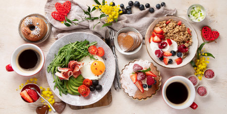Healthy breakfast with oatmeal, berries, egg, bacon and a cup of coffee. Good morning. Top view, panoramaの写真素材