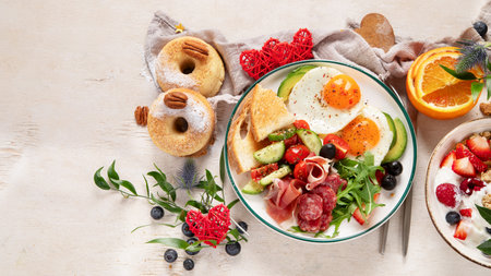 Healthy breakfast with oatmeal, berries, egg, bacon and a cup of coffee. Good morning. Top view, copy spaceの写真素材