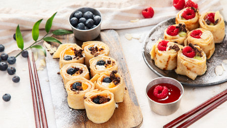 Asian sweet sushi pancake. Rolls with cream cheese berry and fruitsの写真素材