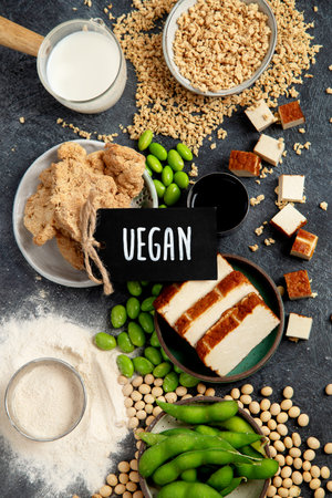 Soy products on black background. Vegan healthy food. Top viewの写真素材