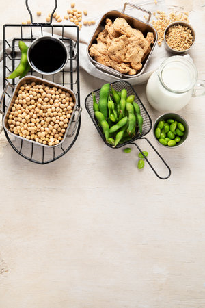 Various soy products with soy bean, tofu, soy sauce and soy milk on a light background. Top view, copy space.の写真素材