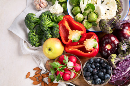 Vegetables, fish, berry on wooden background. Healthy food concept. Top view, copy spaceの写真素材