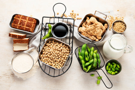 Various soy products with soy bean, tofu, soy sauce and soy milk on a light background. Top viewの写真素材