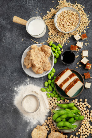 Soy products on black background. Vegan healthy food. Top viewの写真素材