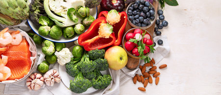 Vegetables, fish, berry on wooden background. Healthy food concept. Top view, banner, copy spaceの写真素材