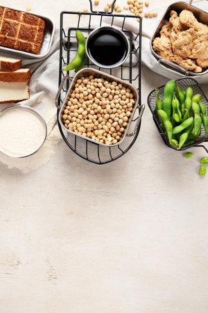 Various soy products with soy bean, tofu, soy sauce and soy milk on a light background. Top view. Copy space.の写真素材
