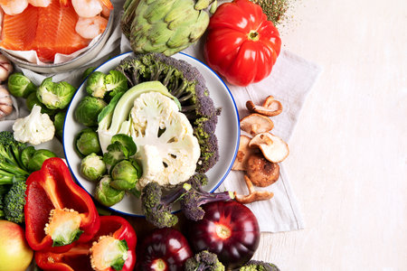 Vegetables, fish, berry on wooden background. Healthy food concept. Top view, copy spaceの写真素材