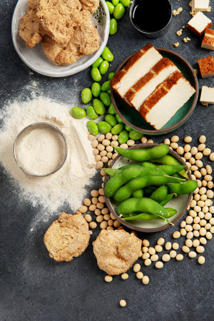 Soy products on black background. Vegan healthy food. Top viewの写真素材