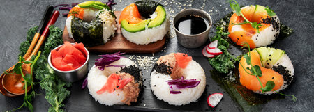 Sushi donuts on a dark background. Hybrid trend food. Panoramaの写真素材