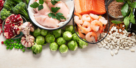 Balanced diet food background. Healthy food selection. Detox and clean diet concept. Foods high in vitamins, minerals and antioxidants. Anti age foods. Top view. Panorama with copy space.の写真素材