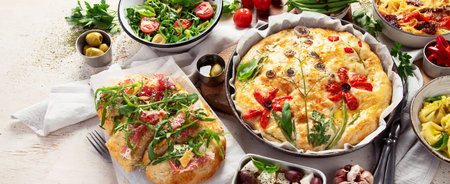 Table of Italian meals. Pizza, pasta, ravioli, focaccia on white background. Healthy eating concept. Top view. Panorama with copy space.の写真素材