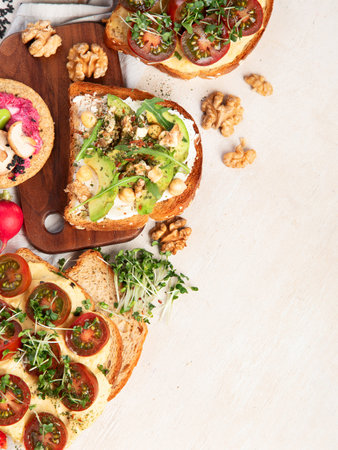 Breakfast with vegetables. toasts, tomato, cucumber, radish, avocado. Vegan healthy food concept....