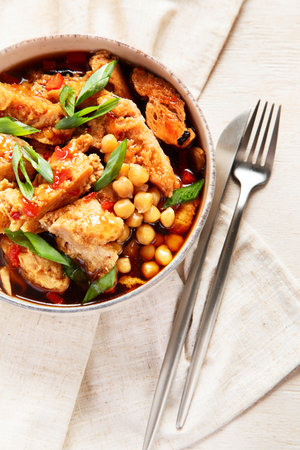 Soybean with soy meat, onion and tofu on light wooden background. Vegan food. Top viewの写真素材