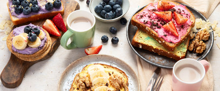 Sweet toast assortment. Banana, cream cheese, peanut butter and strawberry, cream cheese and blueberry on a white background. Top view. Panorama.の写真素材