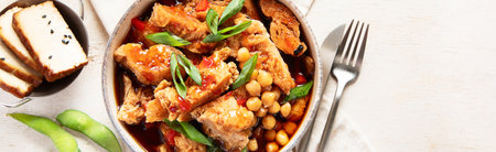Soybean with soy meat, onion and tofu on light wooden background. Vegan food. Top view, copy spaceの写真素材