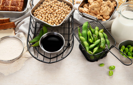 Various soy products with soy bean, tofu, soy sauce and soy milk on a light background. Top view, copy space.の写真素材