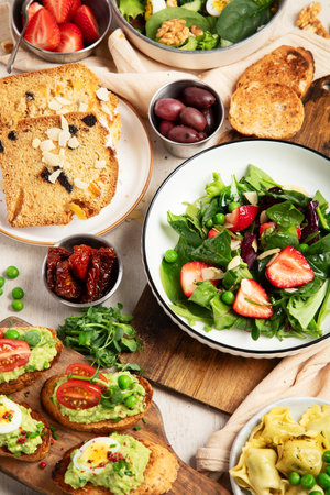Assortment of various dinner food. Vegetarian seasonal summer food. Top view.の写真素材