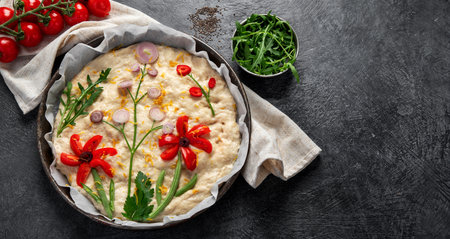 Raw focaccia art on dark background. Italian food concept. Top view, copy space, bannerの写真素材