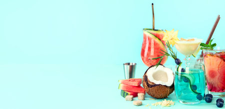 Summer colorful cocktails on blue background. Fresh tasty tropical drinks. Banner, copy spaceの写真素材