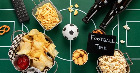 Football game watch party food and snacks on a football field. Football party. Top view.の写真素材