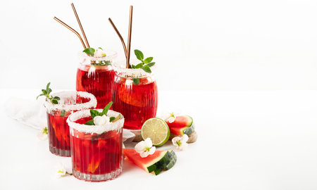 Cold watermelon smoothie. Summer watermelon drink and slices of watermelon on a white background. Top view. Copy space.の写真素材