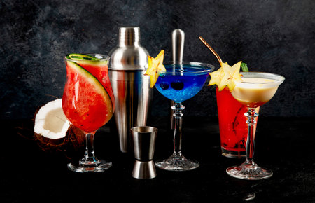 Summer cocktail in glasses on a dark background. Bar delicious drinks.の写真素材