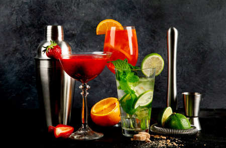 Summer cocktail in glasses on a dark background. Bar delicious drinks.の写真素材