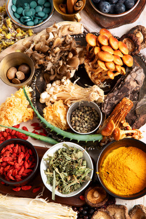 Healthy natural adaptogen. Herbs, spices, mushrooms on light background. Nervine food collection. Top viewの写真素材
