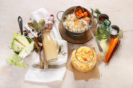 Winter salad of marinated cabbage and carrot Homemade sauerkraut in a jar on wooden background. Top viewの写真素材