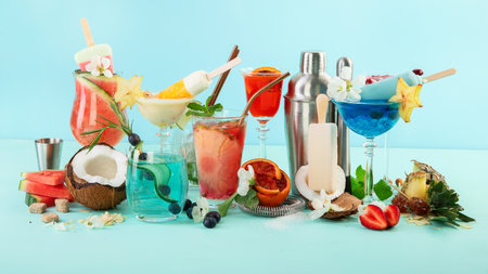 Summer cocktails in classic glasses on blue background. Party time. Tropical drinks.の写真素材