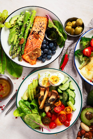 Healthy food, keto diet, diet lunch concept. Assortment of various healthy keto meals Top view on white background.の写真素材