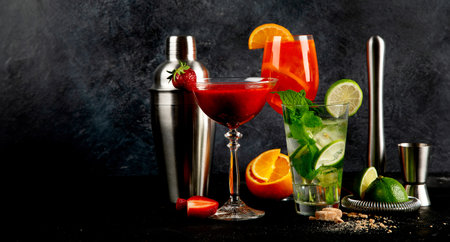 Summer cocktail in glasses on a dark background. Bar delicious drinks. Banner, copy spaceの写真素材