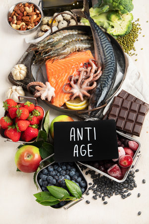Healthy food selection on light background. Detox and clean diet concept. Foods high in vitamins, minerals and antioxidants. Anti age foods. Top viewの写真素材